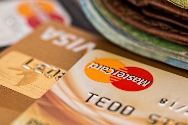 visa and mastercard on a table